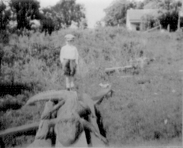 W. T. Block, Jr. with Big Tooth in June 1929 and Old Block Home in Background