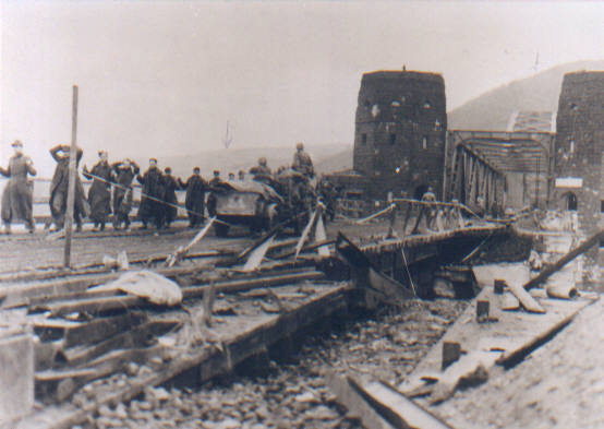 Remagen Bridge, showing German prisoners captured by 78th Infantry Div. being marched to POW camps in the west, March 8, 1945.