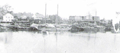Lumber schooner being loaded at Goos' sawmill, Ca. 1880 (Courtesy Archives and Special Collections at Frazar Memorial Library, McNeese State University)